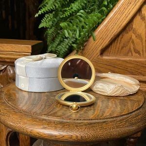 Caron compact mirror with dust bag & original fancy round box. 20+ years old.